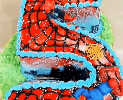 Spiderman Monogram theme Cake with real toy Designs, Images, Price Near Me