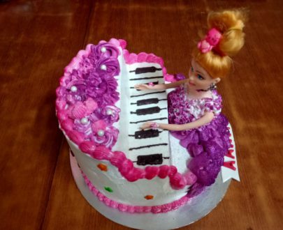 Doll 3D Cake-Doll playing Piano Cake Designs, Images, Price Near Me